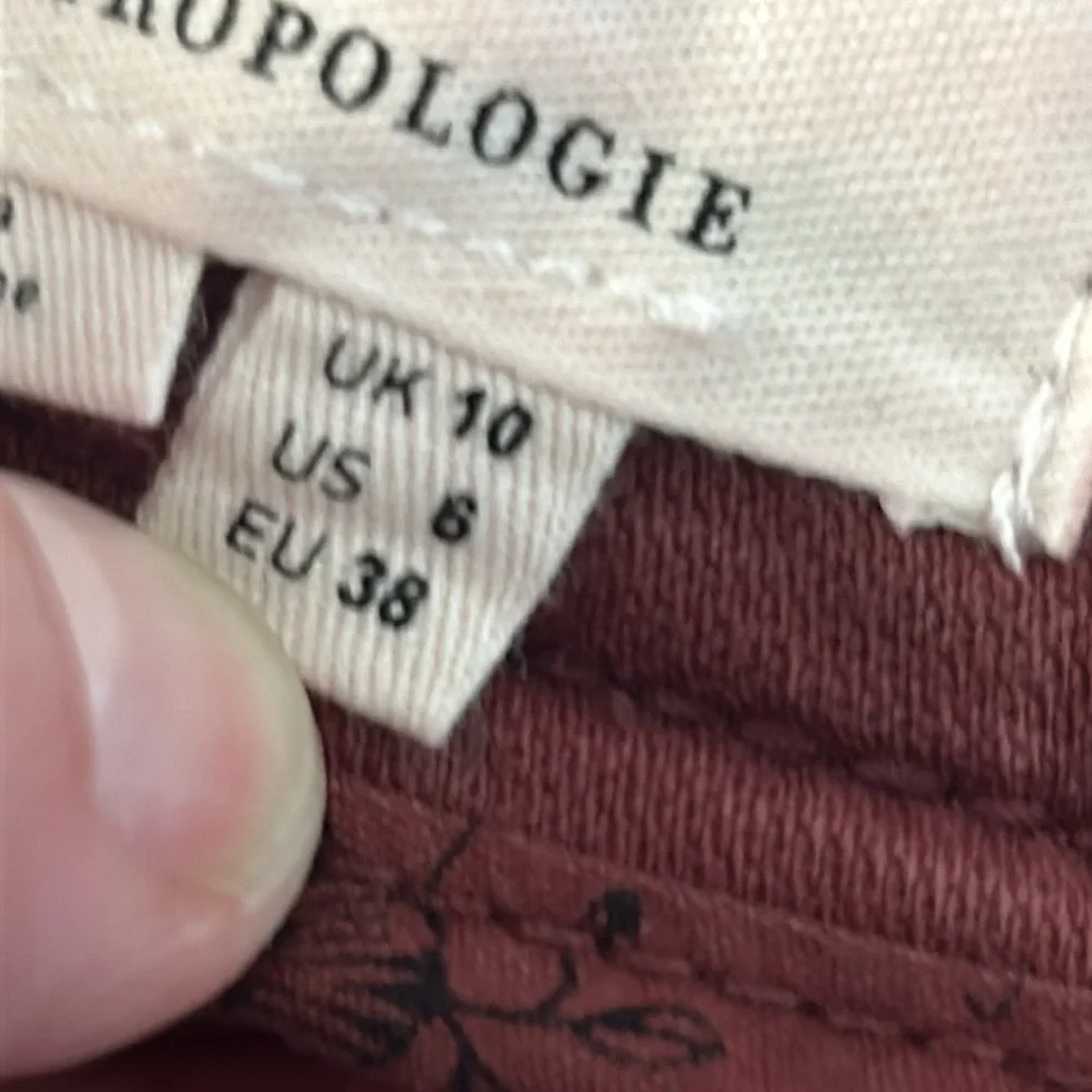 By Anthropologie size 6 raw hem baggy pants in mauve color